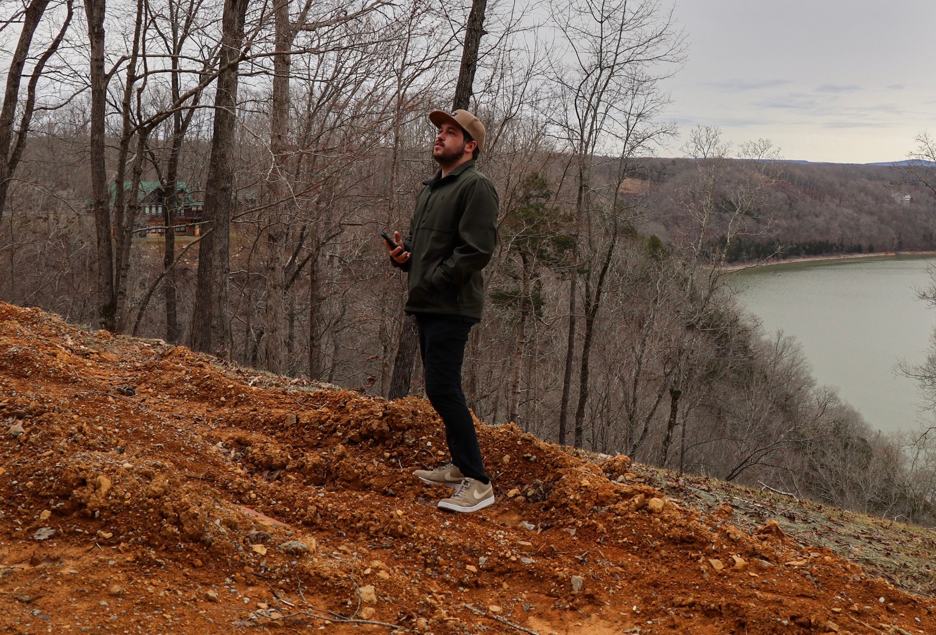 Andrew Loftis on site evaluating a physical environment.